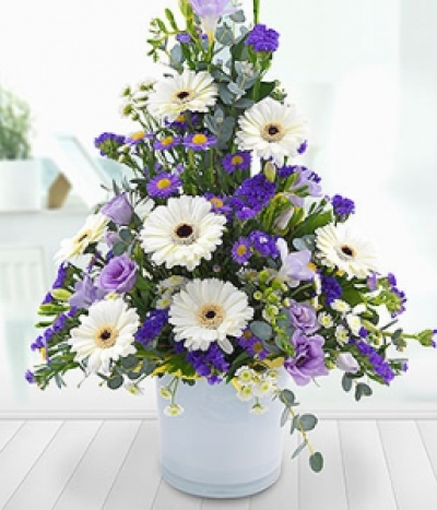 Tranquil Mountain - Germinis, Freesias, Lisianthus, Statis and Asters in cool whites, pretty purples and lilacs create this enchanting and absolutely exquisite centrepiece.