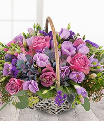 Eden - An adorable mix of beautiful blue Hydrangeas & Eryngiums, pretty pink Roses & Wax Flowers, lilac Freesias, Lisianthus and purple Statice. With a dash of Rosemary this really is a bouquet to delight the senses.