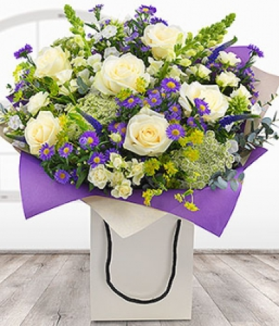 Country Garden Gift Bag - A pretty purple and white Gift Bag Flower Bouquet featuring white Roses, Antirrhinum, Phlox and Ammi with purple Veronica and mauve Aster.