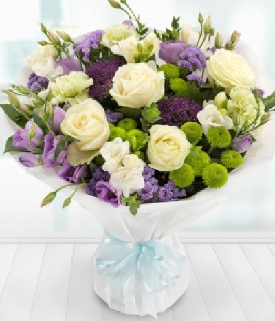 Simply Vintage - A delicate and fragrant mix of white Roses and Freesias with lilac Lisianthus and Trachelium, coupled with lavender Statis, green Spray Chrysanthemums and Carnations.