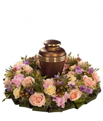 Pink Urn Wreath - A pretty urn wreath base. Pink and cream Roses, pink Hydrangea and Hypericum with purple Lisianthus and white Eryngium. Urn not inclulded.
