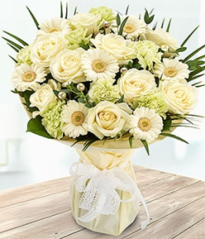 Precious Pearl - An absolutely beautiful white Rose, Germini and green Carnation bouquet with pretty pearl pins.
