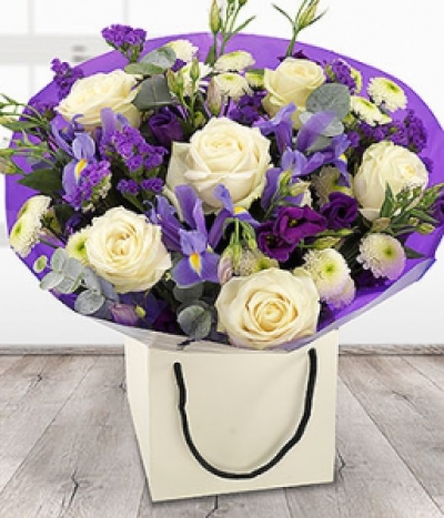 Pride & Joy - A pretty purple and white aqua pack bouquet featuring delicate white Roses and Spray Chrysanthemums with purple Lisianthus, Statis and Irises.