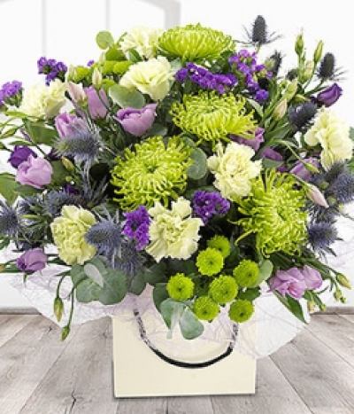 Rain Forest - A cool, fresh, green and purple flower bouquet. Lilac Lisianthus and purple Statis have been cleverly combined with glorious green Chrysanthemums and Carnations to create this particularly unique arrangement.