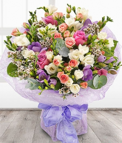 Divinely Delicate - An absolutely beautiful and divinely delicate aqua pack bouquet. Lavender Roses, pink Spray Roses with white and lilac fragrant Freesias sit perfectly alongside pink Wax Flowers.