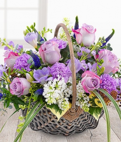 Fabulously Fragrant Lilac - A divinely delicate and fabulously fragrant flower basket. Lilac Roses and Carnations with white Lilacs, lavender Stocks and Freesias mixed with pretty purple Veronica.