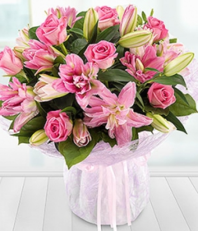 Lavish Rose and Lily - A luxurious pink Rose and Lily aqua pack bouquet exquisitely presented.
