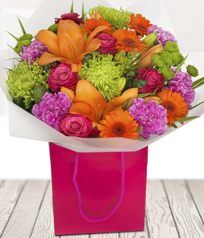 Fruit & Salad - Send your love with this vibrant bouquet of the finest and freshest flowers. Orange lilies, orange germini, finished off with cerise roses for a fantastic and classic bouquet.