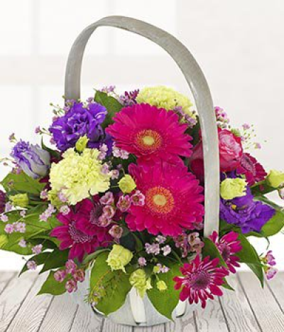 Summer basket of Love - A stunning summery basket arrangement which is hand delivered by a highly skilled florist straight to your address for the ultimate surprise. Bright pinks, vibrant purples with a dash of green throughout.
