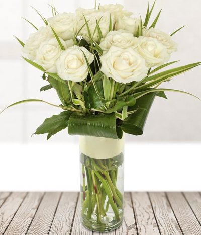 White Pearl - This is stunning bouquet of a dozen avalanche roses, accompanied with aspidistra leaves and arranged perfectly in a glass vase.