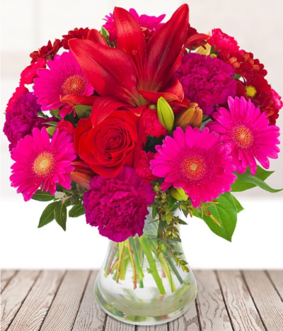 Romancing - We will personally create your bouquet using the finest and freshest rich red, deep pink and burgundy.