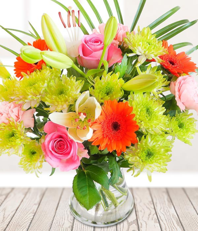 Colour Splash - An array of colourful stems burst through this arrangement, making it the perfect gift that is sure to brighten their day.