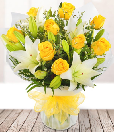 Iconic Smile - It’s a match made in heaven but with a pop of colour, the splash of yellow from the bright roses complements the fresh white lilies to create a truly iconic bouquet.